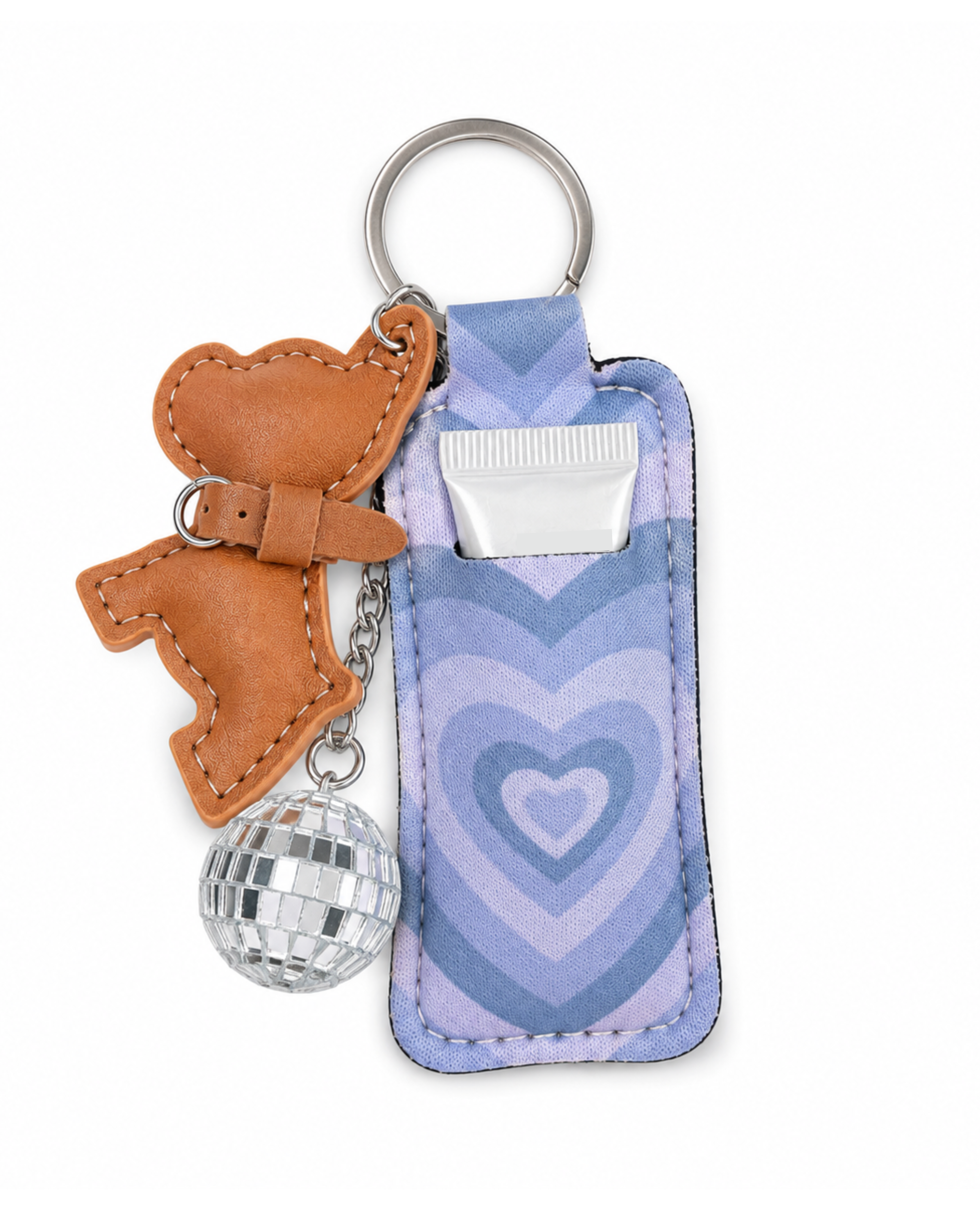 A novelty keychain featuring a light blue and purple heart-patterned pouch, a brown leather dog-shaped charm, and a silver disco ball charm, all attached to a metal split ring on a white background.
